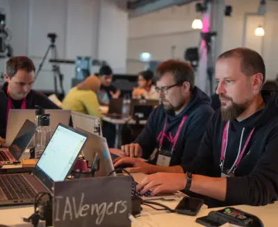 SDV Hackathon participants hacking away on their laptops